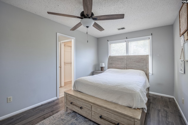 1426 B Ave, West Columbia, SC 29169 - bedroom featuring dark wood finished floors, a textured ceiling, and ceiling fan