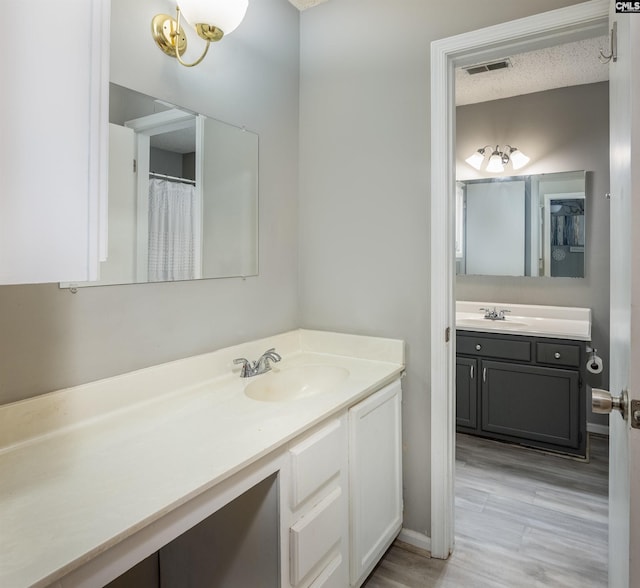 1426 B Ave, West Columbia, SC 29169 - full bathroom with vanity and wood finished floors