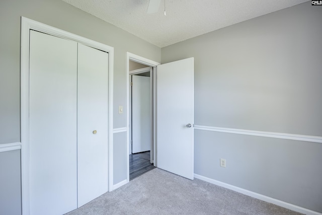 1426 B Ave, West Columbia, SC 29169 - unfurnished bedroom featuring carpet flooring, a closet, a textured ceiling, and ceiling fan