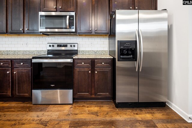 116 Silver Run Pl, West Columbia, SC 29169 - kitchen featuring appliances with stainless steel finishes, decorative backsplash, dark wood-type flooring, and dark brown cabinetry