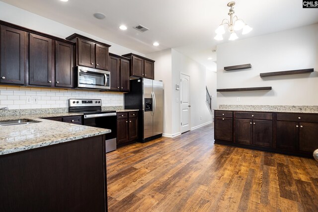116 Silver Run Pl, West Columbia, SC 29169 - kitchen featuring appliances with stainless steel finishes, open shelves, dark brown cabinets, decorative backsplash, and dark wood-style floors