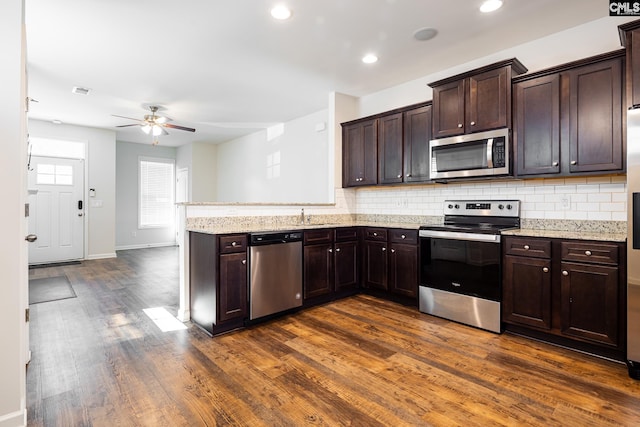 116 Silver Run Pl, West Columbia, SC 29169 - kitchen with stainless steel appliances, a ceiling fan, dark wood-style flooring, decorative backsplash, and recessed lighting
