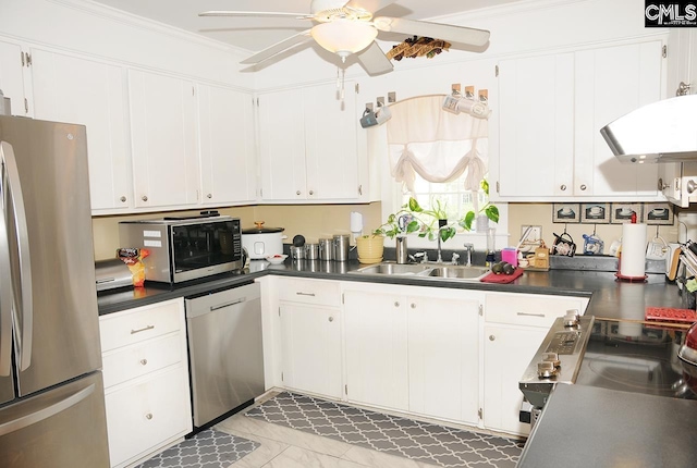 5 Eastpine Ct, Columbia, SC 29212 - kitchen featuring appliances with stainless steel finishes, ceiling fan, dark countertops, white cabinetry, and crown molding