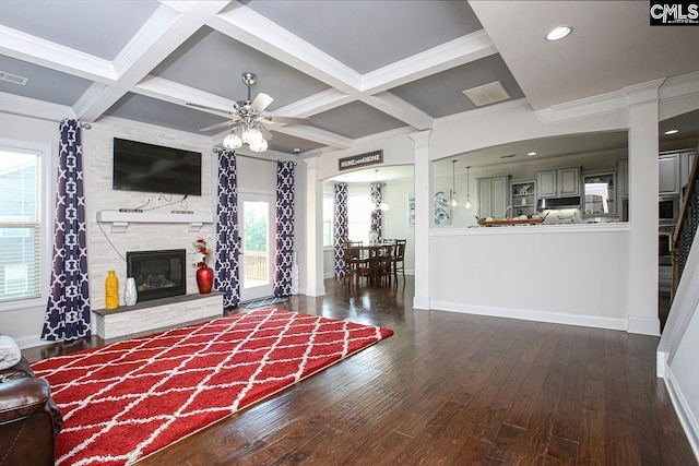 576 Maple Valley Loop, Blythewood, SC 29016 - living room featuring decorative columns, healthy amount of natural light, coffered ceiling, hardwood / wood-style flooring, and beam ceiling
