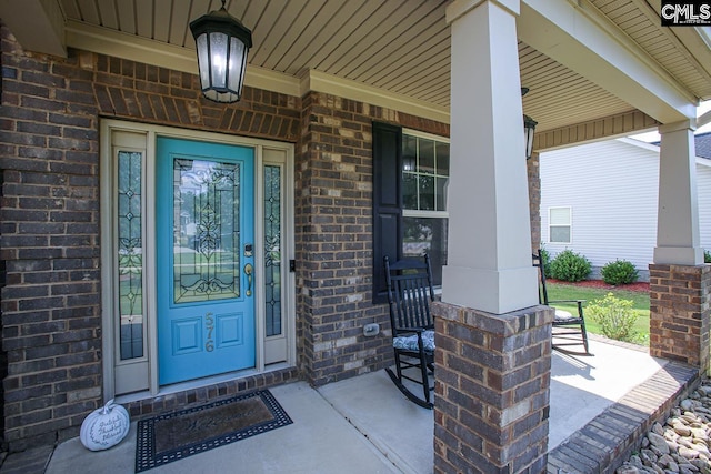 576 Maple Valley Loop, Blythewood, SC 29016 - doorway to property featuring covered porch and brick siding