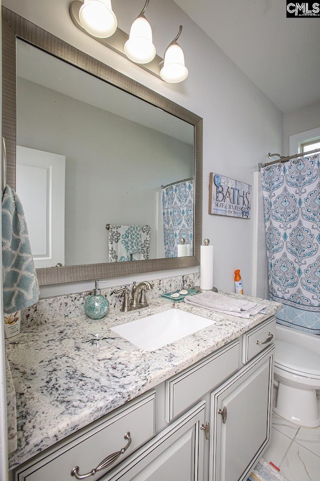 576 Maple Valley Loop, Blythewood, SC 29016 - bathroom with vanity, marble look tiles, and a shower with shower curtain