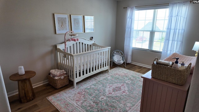 255 Common Reed Dr, Gilbert, SC 29054 - bedroom featuring wood finished floors and a crib