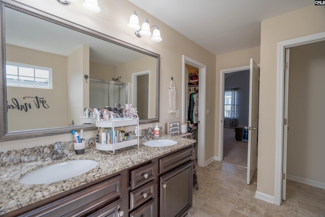 611 Colony Lakes Dr, Lexington, SC 29073 - full bath featuring a shower stall, double vanity, a walk in closet, and tile patterned flooring
