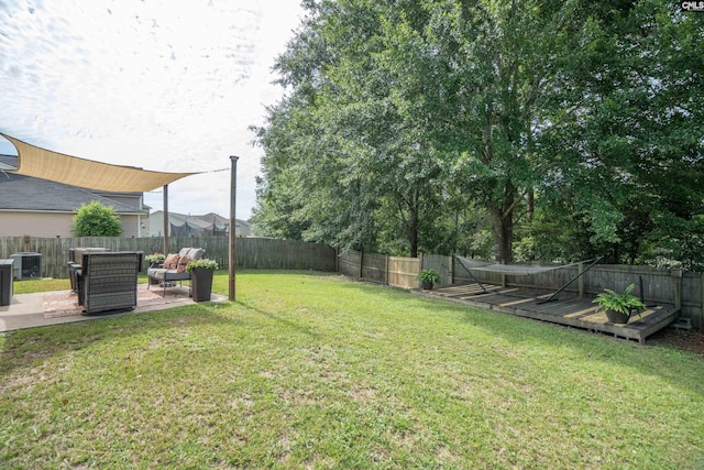 611 Colony Lakes Dr, Lexington, SC 29073 - fenced backyard with a patio area, a wooden deck, and outdoor lounge area