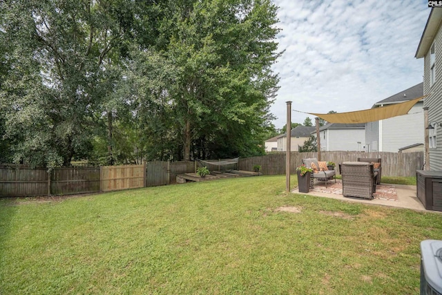 611 Colony Lakes Dr, Lexington, SC 29073 - fenced backyard with a patio area and an outdoor living space