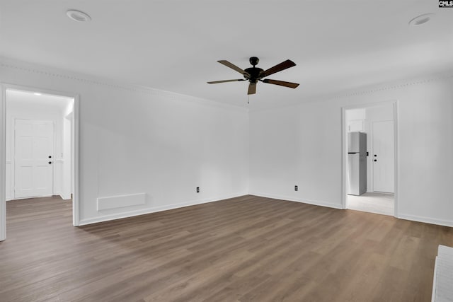 455 Harleston Rd, Irmo, SC 29063 - empty room with a ceiling fan, wood finished floors, and crown molding