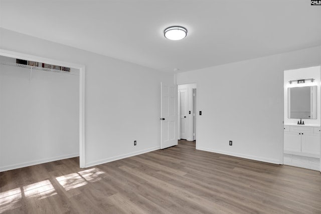 455 Harleston Rd, Irmo, SC 29063 - unfurnished bedroom featuring wood finished floors, ensuite bathroom, and a closet