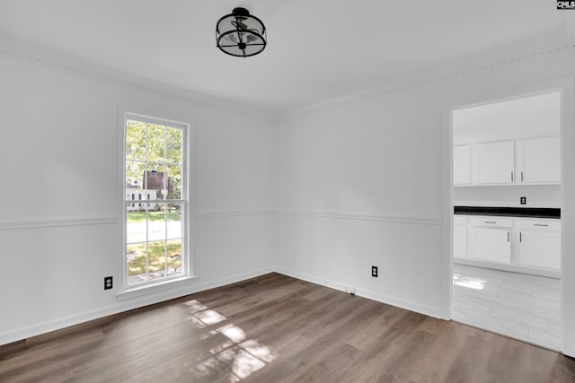 455 Harleston Rd, Irmo, SC 29063 - unfurnished dining area with wood finished floors and crown molding