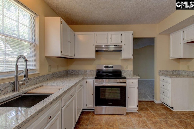 125 Durham Creek Ct, Columbia, SC 29229 - kitchen featuring stainless steel range with electric stovetop, under cabinet range hood, white cabinetry, light stone counters, and a textured ceiling