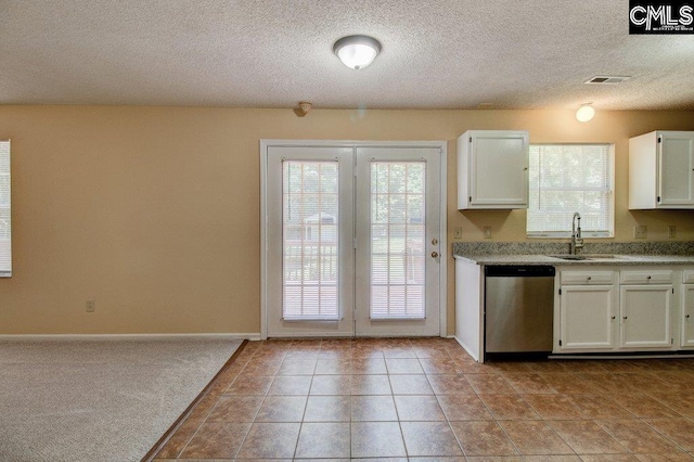 125 Durham Creek Ct, Columbia, SC 29229 - kitchen with stainless steel dishwasher, healthy amount of natural light, white cabinetry, and a textured ceiling