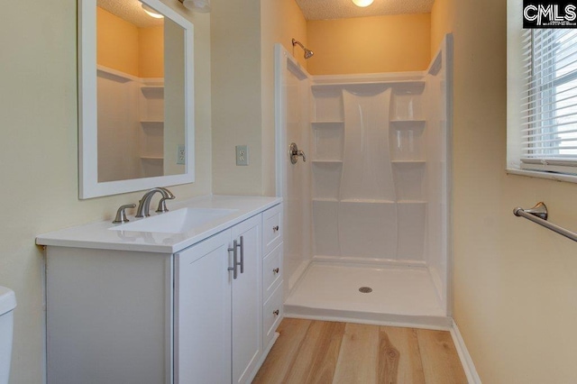 125 Durham Creek Ct, Columbia, SC 29229 - bathroom with wood finished floors, a shower, and vanity
