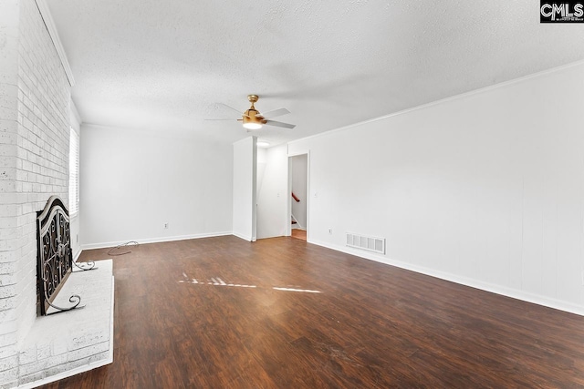 9829 Highgate Rd, Columbia, SC 29223 - unfurnished living room featuring a ceiling fan, a textured ceiling, wood finished floors, a fireplace, and crown molding