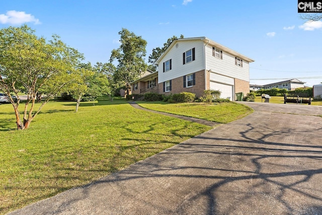9829 Highgate Rd, Columbia, SC 29223 - view of front of home with a garage, asphalt driveway, a front lawn, and brick siding