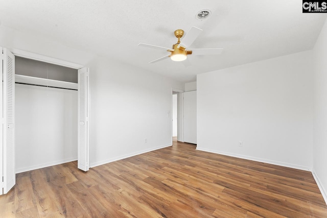 9829 Highgate Rd, Columbia, SC 29223 - unfurnished bedroom featuring wood finished floors, a closet, and ceiling fan