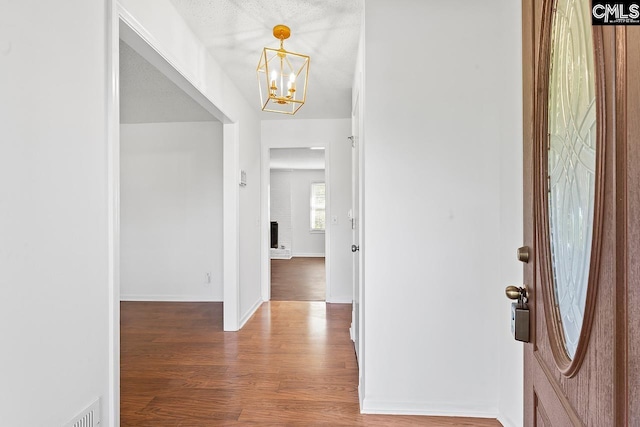 9829 Highgate Rd, Columbia, SC 29223 - foyer entrance with a chandelier and wood finished floors