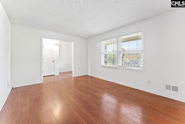 9829 Highgate Rd, Columbia, SC 29223 - unfurnished room with a textured ceiling and wood finished floors
