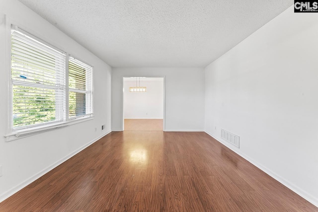 9829 Highgate Rd, Columbia, SC 29223 - unfurnished room with a textured ceiling and wood finished floors