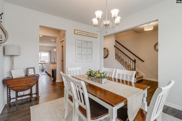 2 Hay Field Ct, Lugoff, SC 29078 - dining space with a chandelier, dark wood-style flooring, and stairway