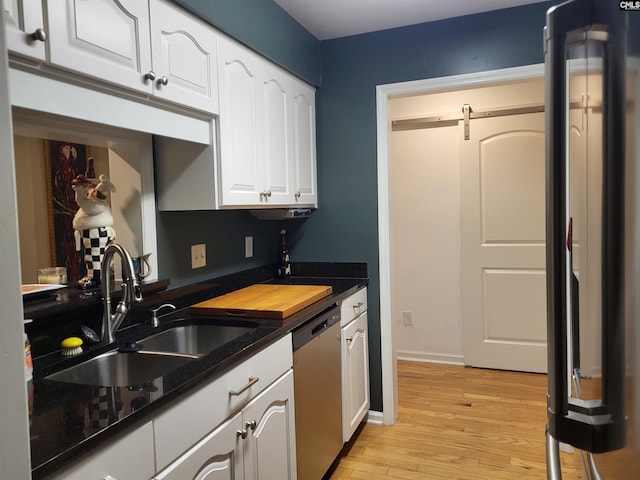 910 Poinsett Pl Unit 3, West Columbia, SC 29169 - kitchen with dishwasher, white cabinetry, light wood-type flooring, and a barn door