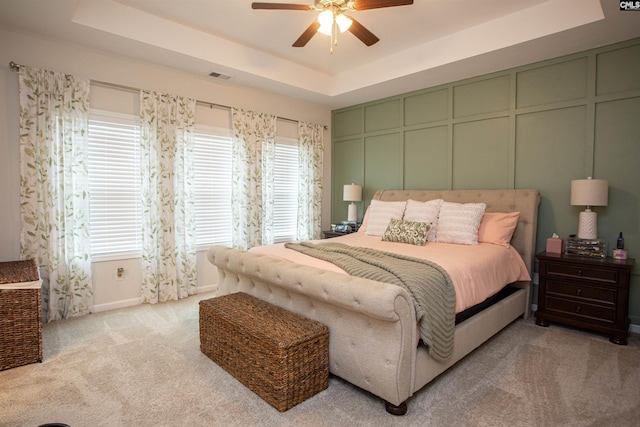 140 Green Ivy Ct, Camden, SC 29020 - carpeted bedroom with a tray ceiling, a decorative wall, and ceiling fan