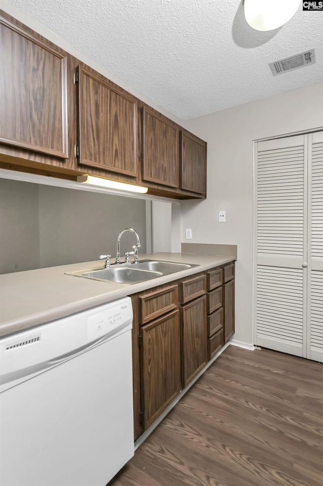 207 Weddell St Unit 2-D, Columbia, SC 29223 - kitchen with white dishwasher, dark wood-style flooring, light countertops, and a textured ceiling