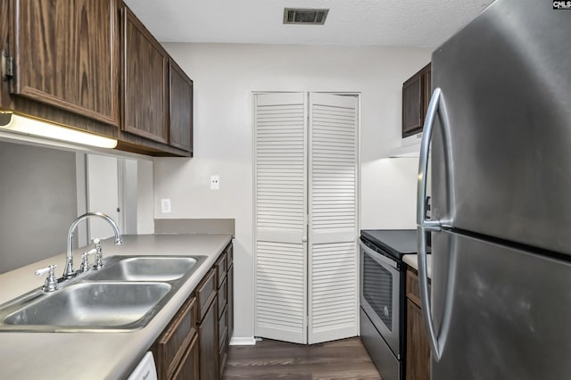 207 Weddell St Unit 2-D, Columbia, SC 29223 - kitchen with stainless steel appliances, dark wood-type flooring, and dark brown cabinetry