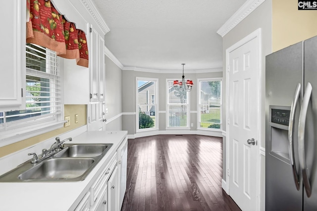 263 Sausage Ln, West Columbia, SC 29170 - kitchen featuring stainless steel fridge, plenty of natural light, light countertops, white cabinetry, and ornamental molding