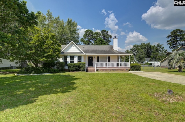 263 Sausage Ln, West Columbia, SC 29170 - view of front of home with covered porch, a chimney, a front yard, and driveway
