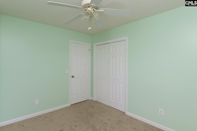 263 Sausage Ln, West Columbia, SC 29170 - unfurnished bedroom featuring carpet, a closet, ceiling fan, and a textured ceiling