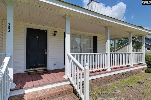 263 Sausage Ln, West Columbia, SC 29170 - doorway to property featuring covered porch, crawl space, and a chimney