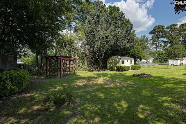 263 Sausage Ln, West Columbia, SC 29170 - view of yard featuring a fire pit and a storage shed