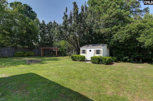263 Sausage Ln, West Columbia, SC 29170 - view of yard with an outdoor fire pit and a storage shed