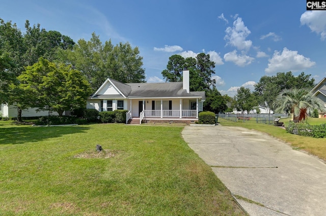 263 Sausage Ln, West Columbia, SC 29170 - view of front of home featuring a porch, driveway, and a chimney