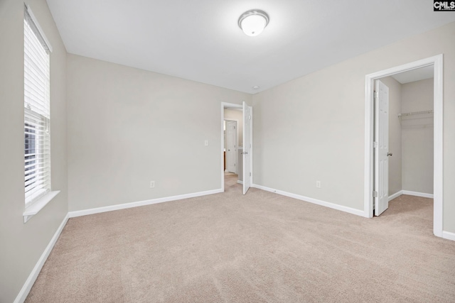 267 Caedmons Creek Dr, Irmo, SC 29063 - unfurnished bedroom featuring light carpet, a spacious closet, and a closet