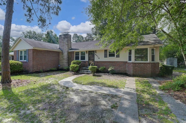 4614 Briarfield Rd, Columbia, SC 29206 - single story home with brick siding, a chimney, and a storage shed