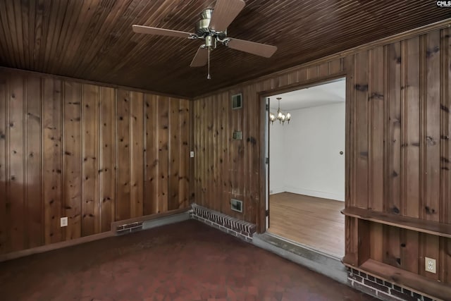 4614 Briarfield Rd, Columbia, SC 29206 - empty room with wooden walls, ceiling fan, a chandelier, and carpet floors