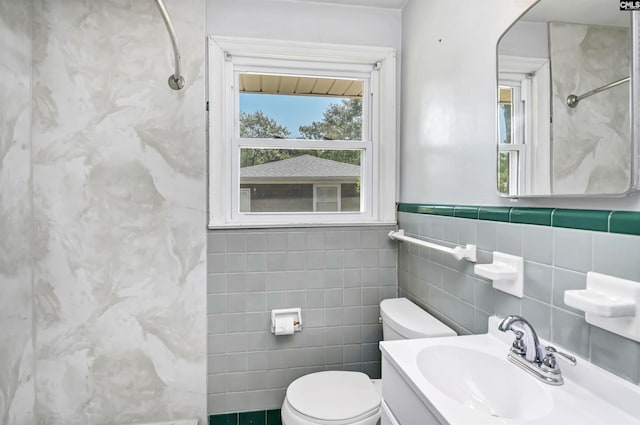4614 Briarfield Rd, Columbia, SC 29206 - bathroom with tile walls, a shower, and vanity