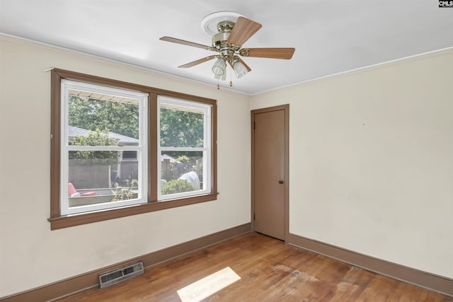 4614 Briarfield Rd, Columbia, SC 29206 - empty room featuring light wood-style flooring, a ceiling fan, and crown molding