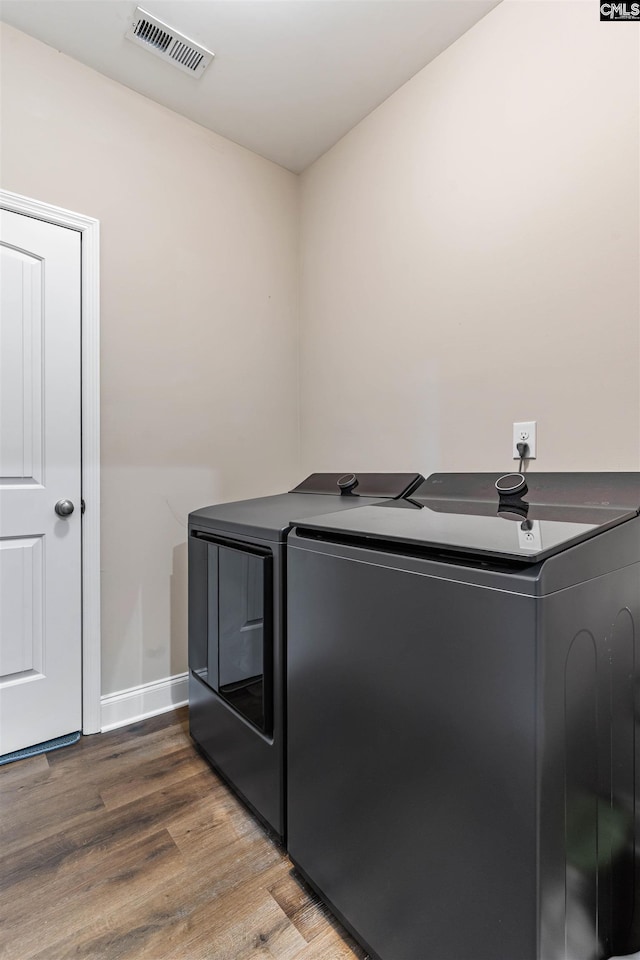 2203 Newberry Landing Cir, Newberry, SC 29108 - laundry room with washing machine and dryer and wood finished floors