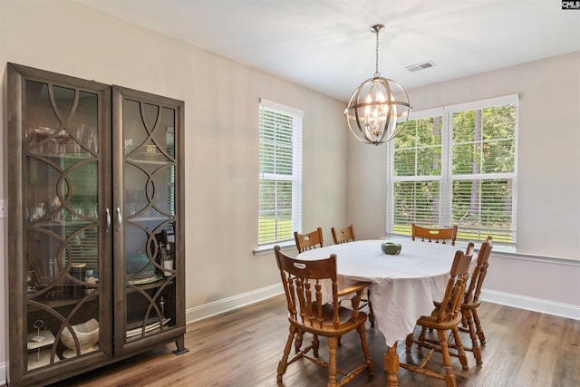 2203 Newberry Landing Cir, Newberry, SC 29108 - dining space with a chandelier, wood finished floors, and healthy amount of natural light