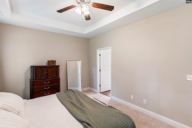 2203 Newberry Landing Cir, Newberry, SC 29108 - bedroom with light carpet, a raised ceiling, and ceiling fan