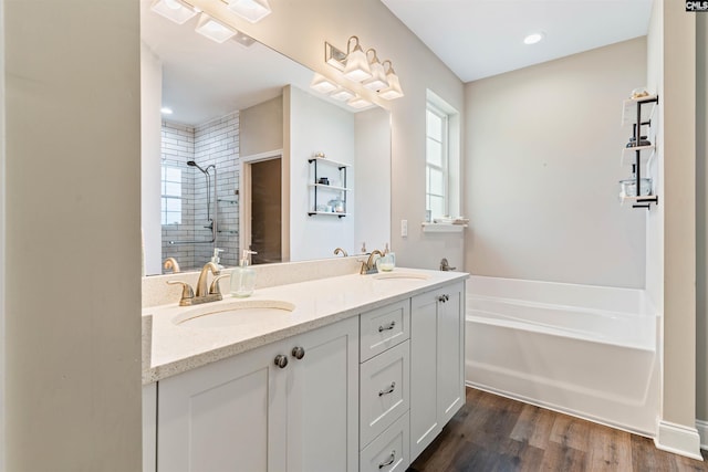 2203 Newberry Landing Cir, Newberry, SC 29108 - bathroom with tiled shower, a garden tub, double vanity, wood finished floors, and recessed lighting