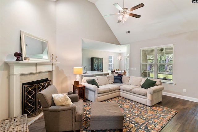 2203 Newberry Landing Cir, Newberry, SC 29108 - living area featuring high vaulted ceiling, ceiling fan, dark wood-style floors, and a tile fireplace