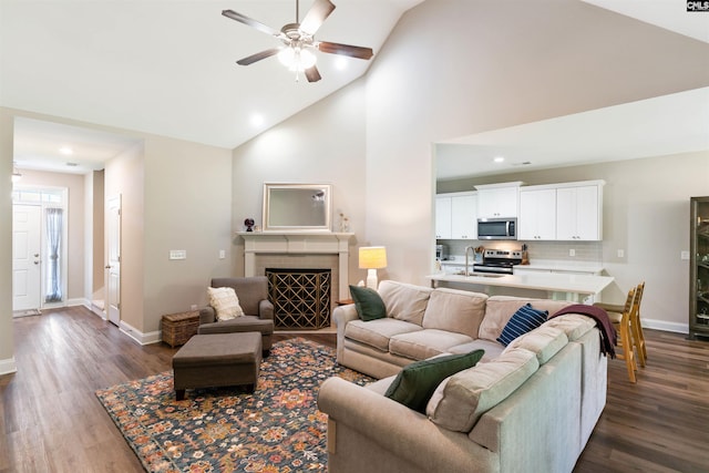 2203 Newberry Landing Cir, Newberry, SC 29108 - living area featuring ceiling fan, high vaulted ceiling, dark wood-style floors, a fireplace, and recessed lighting