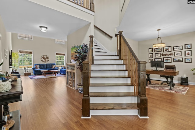 259 Sessions Rd, Elgin, SC 29045 - staircase with wood finished floors and a high ceiling